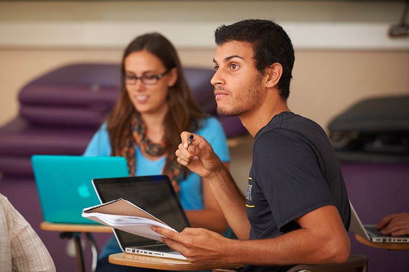 male and female student in a classroom