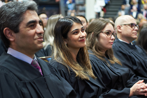 Students smiling at their convocation ceremony