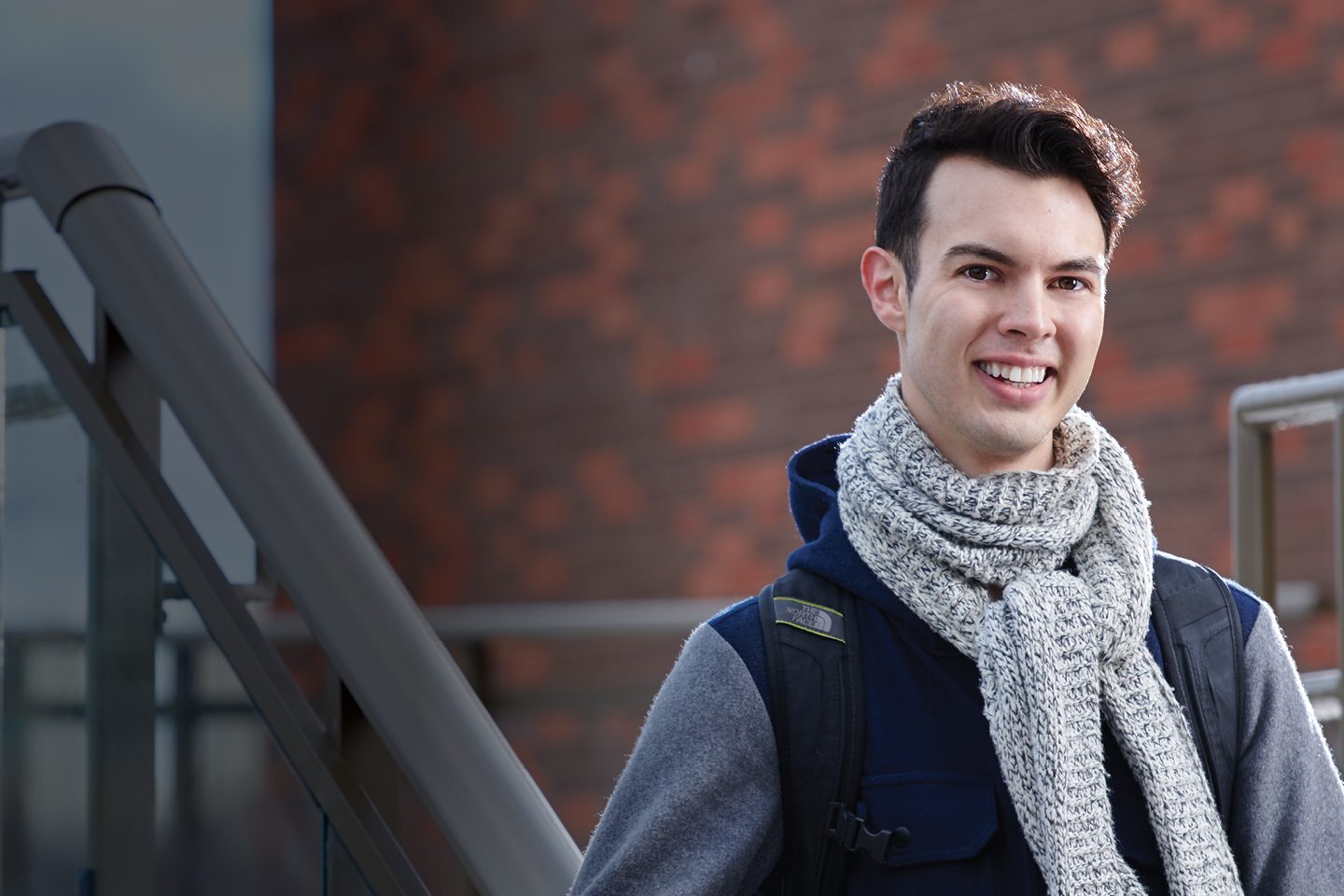 A male student photographed in front of the Toronto campus
